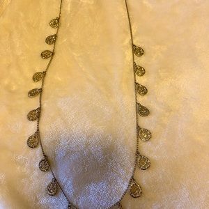 Long Gold tone necklace with Oval disc detailing